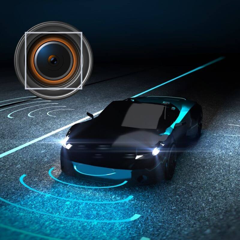 Technical cross-section of a KLC ClearView ultra-thin polyimide heater integrated into an ADAS camera lens assembly for anti-fogging and defrosting in autonomous vehicles.